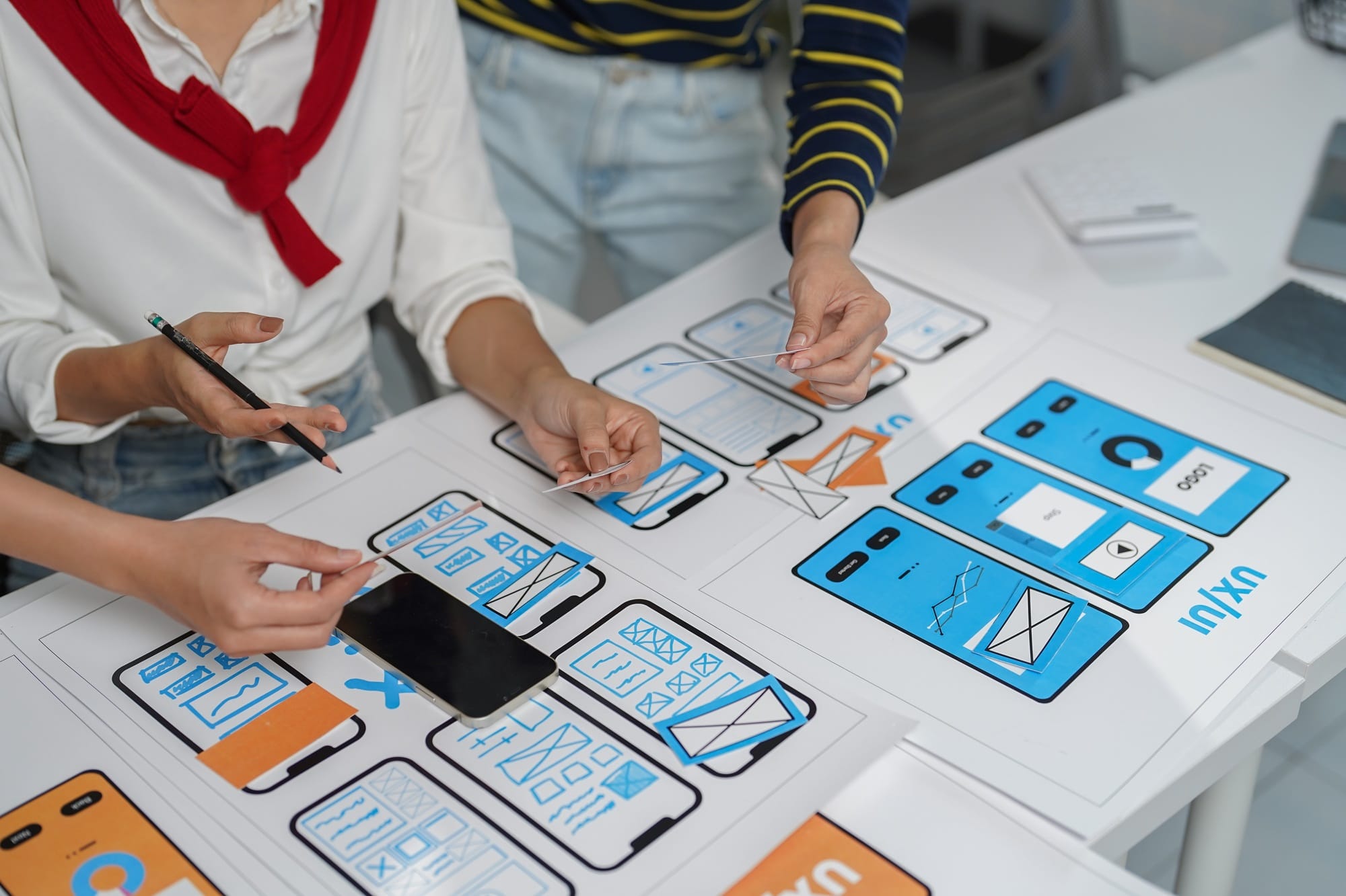 Web designers are building user experience for mobile application using prototyping and wireframing