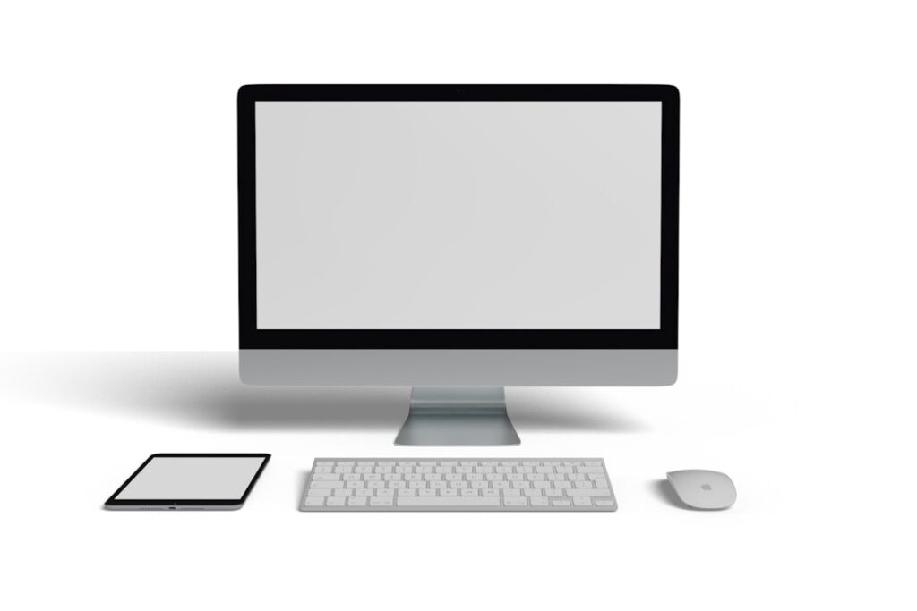 A computer monitor sitting on top of a desk